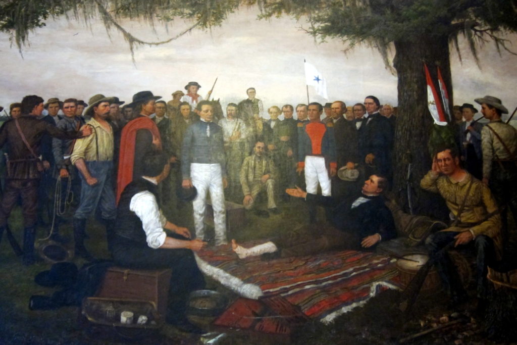 The Surrender of Santa Anna, painted by artist William Henry Huddle, has been on display in the first floor south wing of the Texas State Capitol since February 1891. The painting depicts the morning of April 22, 1836, the day after Texas' victory over Mexico at the Battle of San Jacinto. Mexican General Antonio López de Santa Anna, in the uniform of a private soldier, was brought before Texas General Sam Houston as a prisoner of war. Houston, wounded in the battle, rested on a pallet under the oak tree while arranging an armistice with Santa Anna. To the right, seated on a log, was Erastus (Deaf) Smith, famous Texas scout; the captured Mexican battle flags were leaning nearby against the tree. To the left and rear of Houston was his Secretary of War, Thomas Jefferson Rusk, who was standing next to Colonel Mirabeau B. Lamar. Over thirty other historical figures were depicted in this painting.