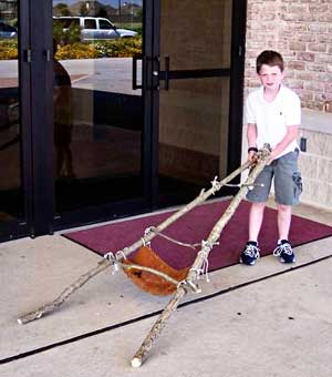 boy with Native American Travois